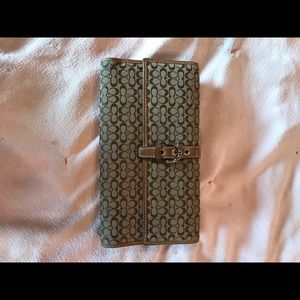 Coach Signature Trifold wallet brown and tan.